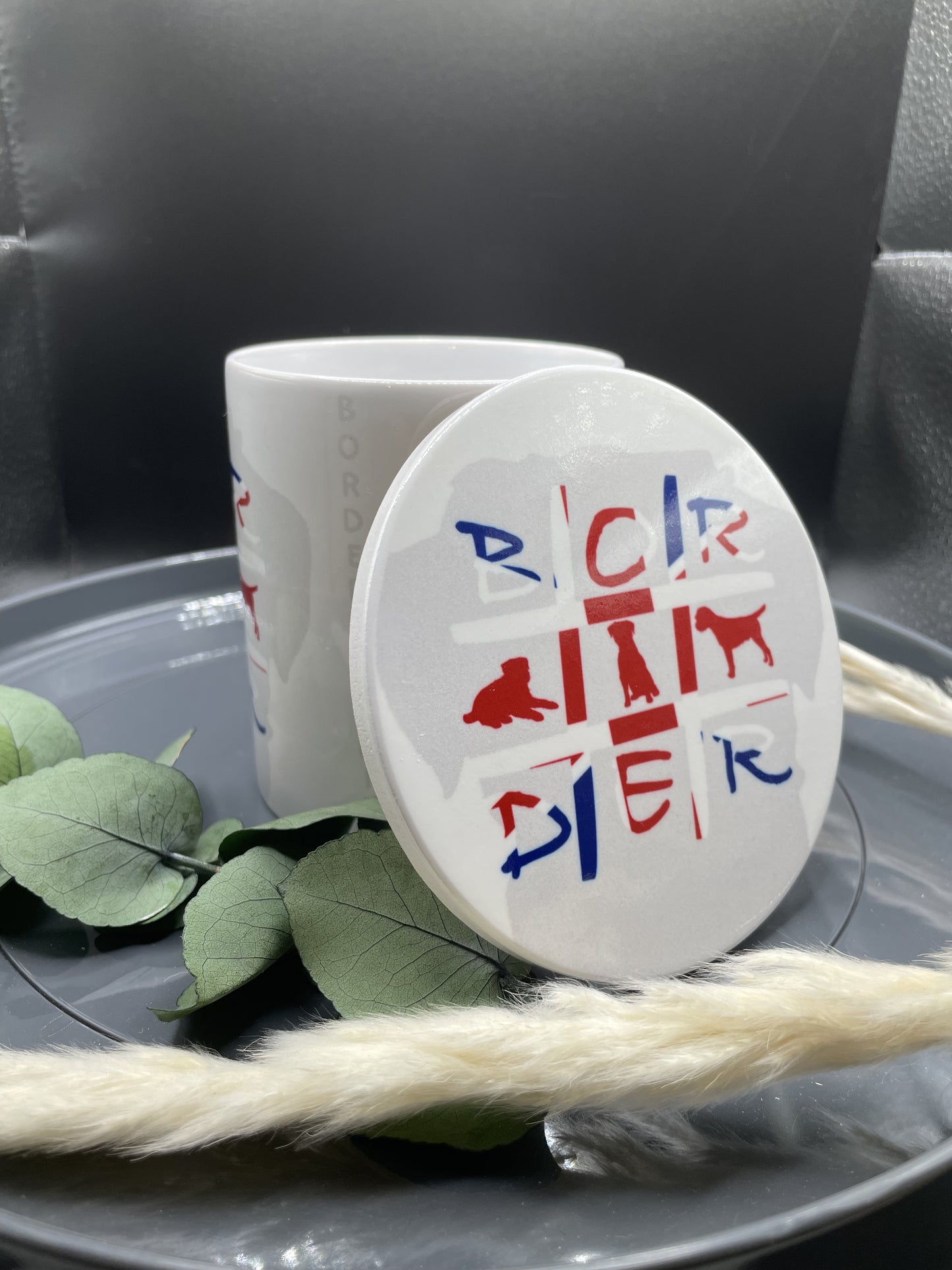 Tasse und Untersetzer mit Border Terrier